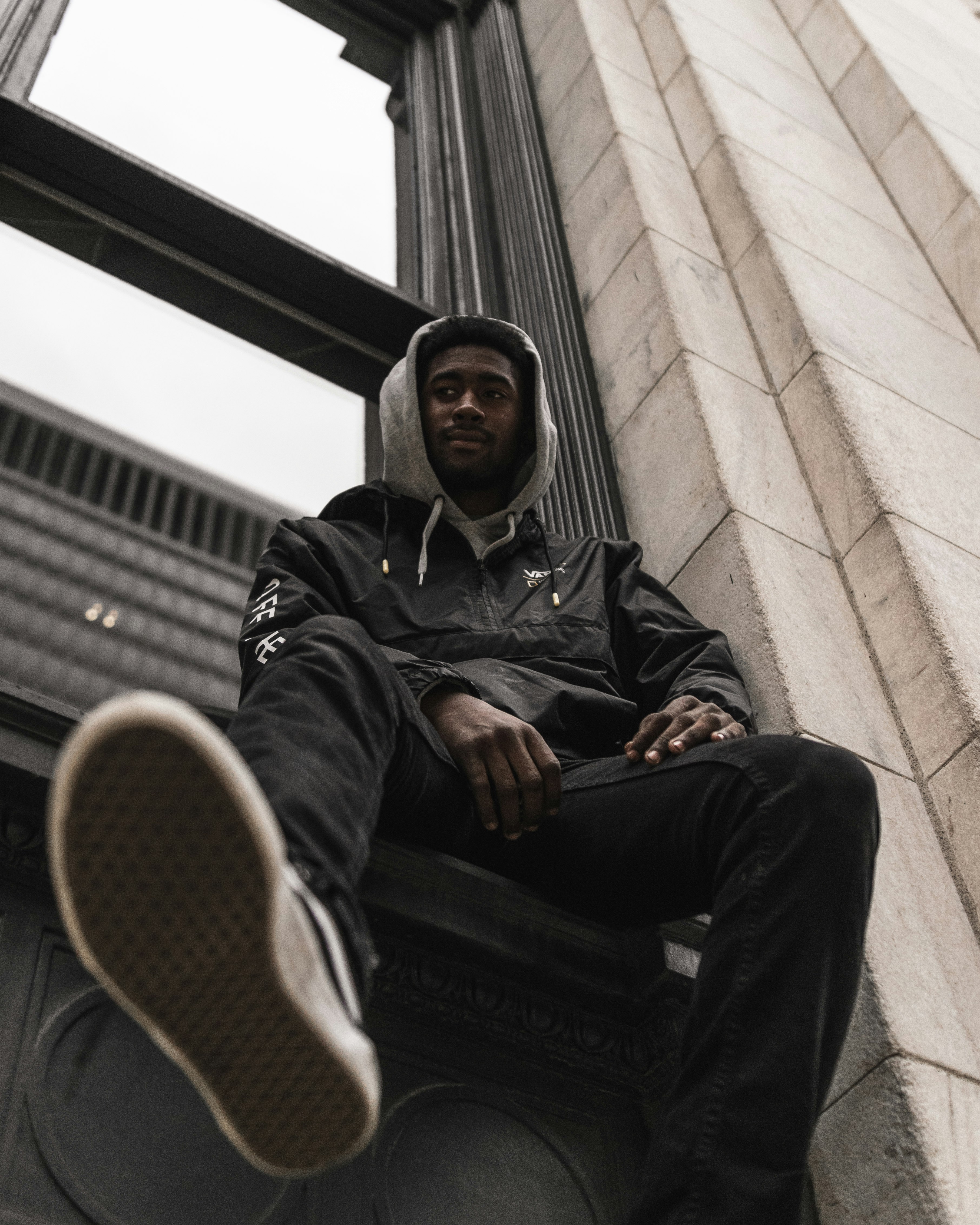 man in black jacket sitting on black chair